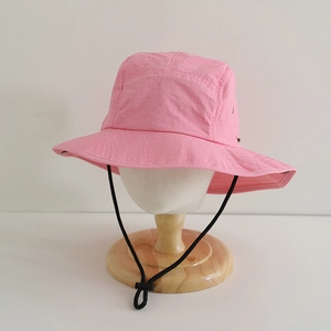 Pink quick-dry sun hat detail featuring adjustable windproof cord and textured fabric