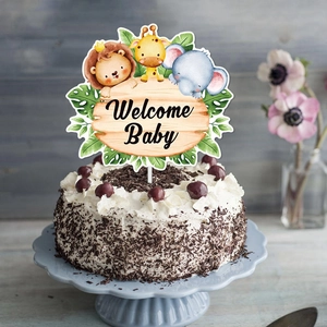 Welcome Baby wooden style cake topper with forest animals and green tropical leaves