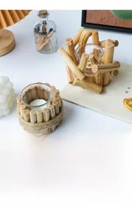 Macro view of rustic driftwood candle holder with jute rope and glass insert