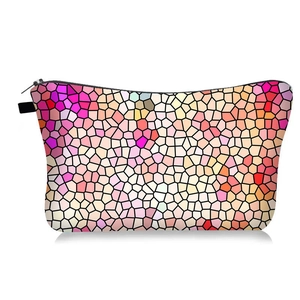 Colorful hexagonal makeup bag with mosaic print and secure black zipper closure