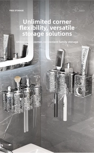 Detail view of wall-mounted bathroom organizer with hammered glass cups and metal rack