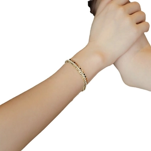 Elegante bracciale regolabile placcato oro con tre file di strass di cristallo scintillanti