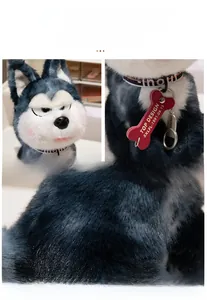 Close-up of husky plush toy featuring grey long-pile fur and a red bone-shaped collar tag