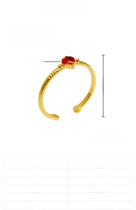 Macro detail of adjustable stainless steel ring with red heart zircon stone