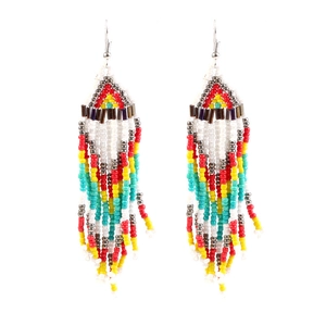 Close-up of handmade bohemian beaded tassel earrings in vibrant multi-color patterns