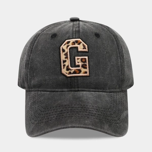 Detail of vintage washed black cotton baseball cap with leopard print letter G embroidery