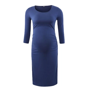 Slim fit dark blue maternity midi dress with crew neck, long sleeves and ruched side details