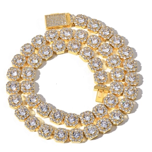 Iced out gold plated Cuban chain necklace with sparkling zircon pave on white background