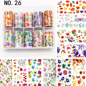 Macro detail of 10 rolls floral nail transfer foils with butterfly and plant patterns