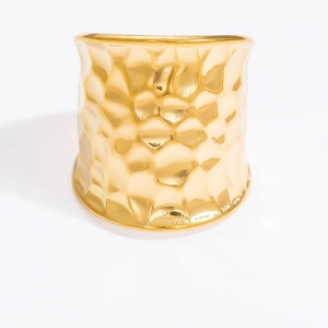 Macro shot of 18k gold plated stainless steel ring with hammered metal texture