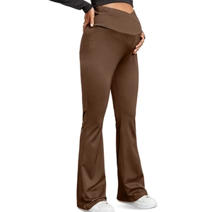 Detail showing the V-shape crossover high waist and flare leg fit of maternity pants