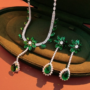 Luxurious green zircon flower necklace and earrings set in an elegant velvet gift box
