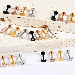 Variety of stainless steel labret studs in heart butterfly and crown shapes four colors