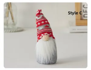 Detail of Christmas gnome with snowflake knit hat, white beard and soft plush textures