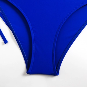 Detail of royal blue swimsuit featuring durable double-stitch seams and high-stretch fabric