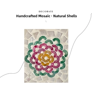 Close-up of handmade floral pattern shell inlay on a luxury crossbody bag detail