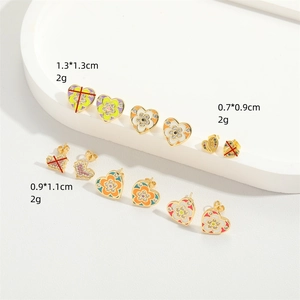 French retro heart enamel earrings with floral patterns in various sizes on white background
