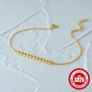 Elegant S925 sterling silver gold bracelet with a curved row of sparkling cubic zirconia
