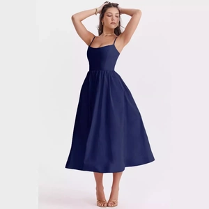 Elegant navy blue satin slip midi dress with an open back for summer parties and events