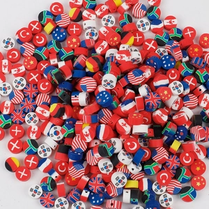 Close-up of assorted polymer clay beads with various national flag patterns for DIY crafts