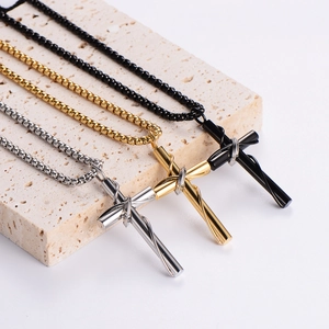 Three stainless steel necklaces with intertwined cross pendants in black gold and silver
