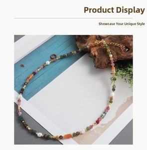 Macro shot of colorful tourmaline beads and pearls necklace with gold adjustable clasp