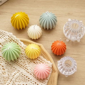 Pumpkin shaped candle molds made of acrylic with colorful wax finished samples