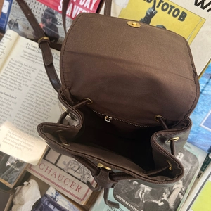Vintage brown leather backpack for women with drawstring closure and magnetic flap