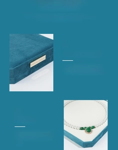 Detail of teal velvet jewelry box with soft Korean velvet and metal fashion logo