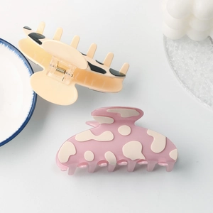 Lot de deux pinces à cheveux à motif vache en abricot et rose pour coiffure élégante
