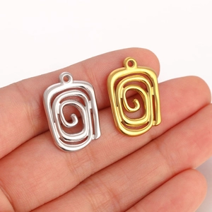 Spiral cutout square stainless steel pendants in gold and silver finish shown on hand