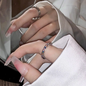 Elegant silver open ring with colorful zircon rainbow stones shown on hand