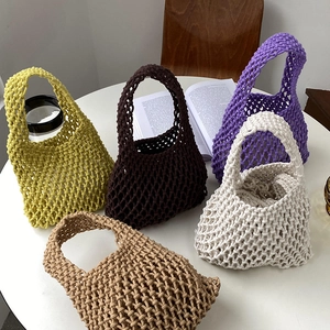 Group display of hand-woven cotton rope tote bags in five natural earth-tone colors