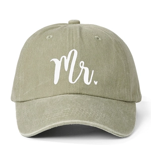Washed khaki green baseball cap with white Mr. embroidery and heart on a white background