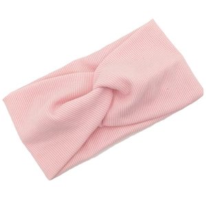 Pink knitted stretch headband for babies and toddlers with a stylish twist knot detail