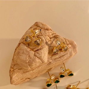 Chic cherry shaped earrings with heart-cut crystals and gold-plated finish on natural stone