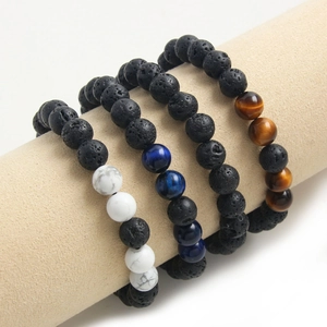 Adjustable natural stone beaded bracelets with tiger eye, lava rock and turquoise on display