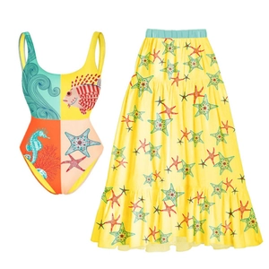 Women's one-piece starfish print swimsuit set with matching layered yellow maxi skirt