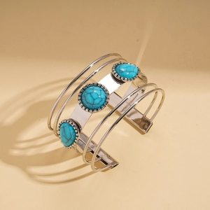 Detail view of silver bohemian cuff bracelet with three oval turquoise stones and 925 stamp