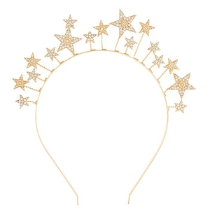 Close-up of golden thin headband with sparkling rhinestone star charms on white background