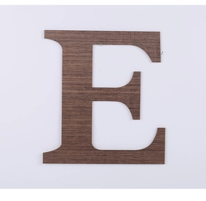 Close-up of decorative wooden letter E with natural grain texture for wall hanging