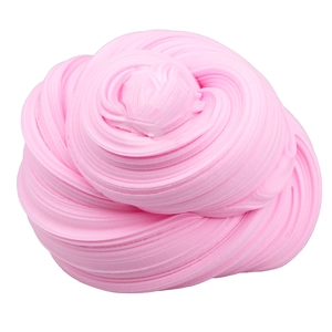 Detailed close-up of fluffy pink slime showing soft spiral texture on white background