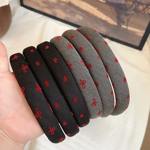 Polka dot headband with red hearts and bows design in black and grey fabric
