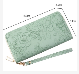 Light green long wallet with 3D floral embossing and dimensions 19.5 x 10 x 2.5 cm