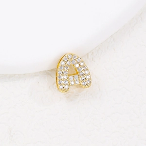 Golden letter A pendant necklace with sparkling clear zircon stones on white background