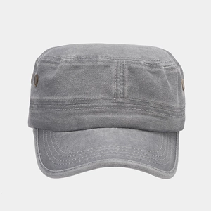 Detail view of washed cotton military cap with metal eyelets and reinforced stitching