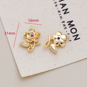 Detail of 21mm gold-plated floral pendant with red gemstone and zircon for DIY jewelry