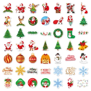 Macro view of assorted holographic Christmas stickers featuring Santa and reindeer motifs