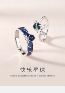 Macro view of S925 sterling silver couple rings with blue enamel and moon star details
