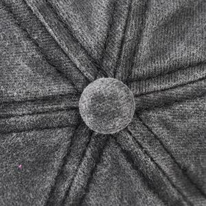 Detailed macro view of the dark grey washed cotton baseball cap with reinforced top button